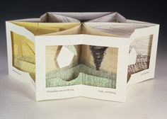 an origami box with two pictures inside