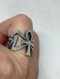 Cool Vintage Rock and Roll star men's ring Nice heavy ring vintage casting in silver white bronze Unused stock from the 1980's I have an assortment of sizes from 6.75, 7, 7.75, 12.75, 13, 13.25, 13.75 14 and 14.25 some half sizes. Please add your size to the order in a message and I will send the size you require. If I am out of stock in your size, I will list the ones I have available for replacement. My jeweler can re size them for a $20 fee. If I am sold out in the sizes you would prefer, I w Silver Ankh Shaped Pierced Jewelry, Bohemian Ankh Silver Jewelry, Vintage Silver Ankh Jewelry, Sterling Silver Ankh Engraved Jewelry, Bohemian Nickel-free Ankh Jewelry, Egyptian Ankh, Vintage Rock, Men Ring, Cool Vintage