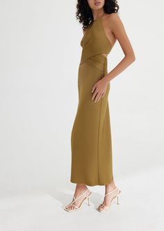 Designed by Significant Other. Crafted with the event season in mind, the Alix Dress in Olive is designed to be fitted through the bodice and drape elegantly toward the hem. Halter neckline with front cut out detail, gathered fabrication at the waist with luxe gold hardware polishing off this elegant silhouette. Fit: Model is 180cm / 5′10″ wearing an AU 8 / US 4 Materials + Care: 62% Viscose Rayon, 38% Polyester. This fabric has been specially woven. Because of its delicate design and characteri Viscose Rayon, Halter Neckline, Significant Other, Halter Neck, Modern Woman, Gold Hardware, Neck Tie, Bodice, Cut Out