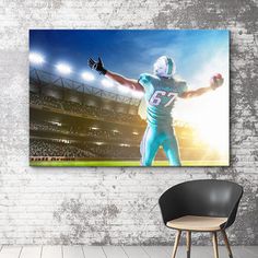 a football player with his arms wide open in front of an empty stadium wall art print