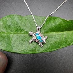 Visit our online shop at: Etsy.com/shop/925ForHer *sterling silver necklace pendant / sea turtle *small pendant with the option to buy a silver box chain necklace 16, 18, or 20 inches *southwestern jewelry *blue opal / lab created / inlaid opal *calibrated pre-cut stones: inlaid blue opal *back of jewelry items are all covered / do not show the back of stones *all jewelry items are made to ship, slight variations in stones will occur compared to pictures. *size of a penny is 19mm or a dime is 18mm in diameter for comparing the size with jewelry items. *free small convenient gift box *free shipping in the US, shipping from the US without insurance. *most orders will be shipped same day or within 24 hours from the time of placing orders during USPS working hours. *seller provides one-time FR Turtle Shaped Sterling Silver Jewelry Gift, Sterling Silver Turtle Jewelry Gift, Handmade Sterling Silver Turtle Jewelry, Handmade Turtle-shaped Sterling Silver Jewelry, Silver Turtle Necklace For Gift, Sterling Silver Turtle Necklace For Gifts, Sterling Silver Turtle Necklace For Gift, Colorful Sea Turtle, Necklace Blue Stone