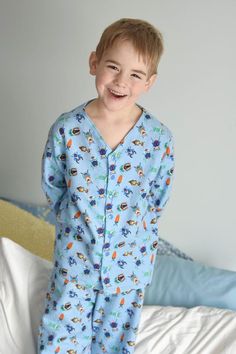 "Comfort is the main goal with this adorable pajama top pattern! This collarless button up PJ top pattern can be made in a large variety of woven fabrics and offers two sleeve lengths. Vick and Vicky's Button Up PJ Top is perfect for any season! You're little ones will love snuggling up in this one!  If you are looking for the full PJ Set please see my pajama set bundle. Pattern comes with a full tutorial and color photos in an easy to print PDF. Tutorial includes body measurements chart, fabric Printed Relaxed Fit Tops For Pajama Party, Casual Long Sleeve Patterned Sleepwear, Blue Cotton Sleepwear With Button Closure, Blue Sleepwear With Button Closure For Loungewear, Blue Sleepwear With Button Closure, Playful Long Sleeve Sleep Top, Cotton Tops With Button Closure For Pajama Party, Patterned Printed Top For Loungewear, Cotton Button-up Tops For Pajama Party