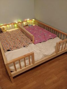 the bed is made up and has two lights on each side, but no sheets