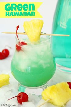 a green hawaiian drink with pineapple and cherries