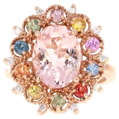 4.37 Carat Morganite Diamond Multi Color Sapphire Rose Gold Cocktail Ring This ring has a natural oval cut pink morganite that weighs 3.32 carats, natural round cut multicolor sapphires that weigh 0.89 carats, and also natural round brilliant cut diamonds that weigh 0.16 carats (Clarity: SI2, Color: F) The total carat weight of the ring is 4.37 carats It is set in 14 Karat Rose Gold and weighs 6.5 grams Ring Size is 7 (complimentary ring sizing available) Rose Gold Cocktail, Morganite Diamond, Gold Cocktail Ring, Gold Cocktail, Pink Morganite, Round Brilliant Cut Diamond, Cocktail Ring, Morganite, Cocktail Rings