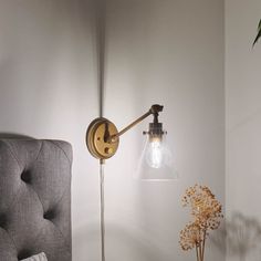 Timeless, versatile, and elegant, the Rosewood 1 light plug-in wall sconce in natural brass updates the traditional, instantly adding dimension and style to your space. A DIYer's dream, plug-in wall lights make installation as easy as hanging up a picture on the wall. You just need a few tools and an outlet; it's as simple as that. The option to plug in the light makes updating various locations in a home, condo, or apartment a breeze. Create that cozy reading nook you've been dreaming about or shine a light (or two) on your new home office, gym, or craft room. Equally functional and stylish, the arms on Rosewood sconce lighting move up and down while its shade swivels left, right, up, and down, allowing you to customize the angle and direction of light. Its clear shade adds an ambient glo Wall Mount Lights Bedroom, Wall Mounted Lights Bedroom, Bedroom Wall Sconces Bedside Lighting, Picture On The Wall, Plug In Wall Lights, Reading Wall, Office Gym, Cozy Reading Nook, Cozy Reading