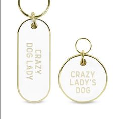 a dog tag with the words crazy lady's dog on it and a keychain