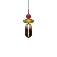 a colorful bird feeder hanging from a wire