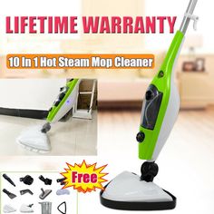 a green and white steam mop is on the floor