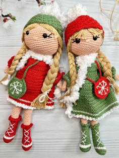 two crocheted dolls sitting next to each other