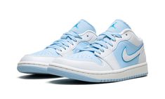 The Women’s Air Jordan 1 Low SE “Ice Blue” is a women’s-exclusive colorway of the low-top retro basketball shoe with a decidedly “UNC” inspired vibe.  The shoe features an Ice Blue perforated leather toe, mid-panel, and nylon tongue.  Contrasting white leather appears on the toe cap, forefoot, eyelets, and heel.  A white leather Swoosh is found on the sides and Ice Blue “Wings” branding is embroidered on the heel.  A blue Jumpman is stitched onto the tongue.  Release date: January 9, 2023 Jordan 1 Lows Women, Jordan 1 Low Women, Air Jordan Blue, Sneaker Displays, Sneakers Box, Kobe Shoes, Retro Basketball Shoes, Blue Jordans, Retro Basketball