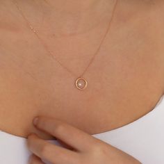 "Dainty 14k Gold Circle Necklace with Pearl, Gold Pearl Jewelry, Solid Minimal Pearl Pendant, Wedding Accessory, Valentines day Gift for Her All of our products has the stamp \"585\" on them. (which states that this is real gold) Our product weighs 1.99 gr and the chain length is 42 cm. There may be +/- 0.15 change in gram information due to production. Your products will be shipped with free shipping UPS express within 1-3 business days. Quality control has been done. Our products are Anti Alle Minimal Pendant, Simple Pearl Necklace, Gold Pearl Jewelry, Necklace With Pearl, Single Pearl Necklace, Gold Circle Necklace, Evil Eye Necklace Gold, Ring Pearl, Pearl Drop Necklace