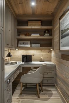 a home office with wood paneling and built - in shelving, including a chair