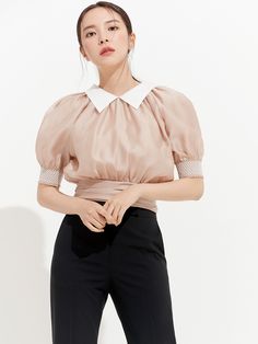 Editor's NotesThis blouse is made of tencel material with a subtle sheen with a voluminous neckline and a rich silhouette shoulder line. The three-dimensional voluminous shoulder line and sleeve silhouette that makes an outfit stnad out.- Sheer design blouse top- Wide waistband detail formed by pleats- Creates a rich silhouette from the upper body to the waist - Elasticity overall sleeves and waist- Luxurious and feminine moodMeasurements(in.) 0 / 1 / 2- Length from center back: 18.70& Silk Office Top With Collar, Office Silk Top With Collar, Chic Silk Top With Collared Neckline, Silk Collar Top For Work, Feminine Puff Sleeve Tops For Formal Occasions, Elegant Collared Puff Sleeve Top For Workwear, Elegant Collared Tops With Blouson Sleeves, Feminine Puff Sleeve Formal Tops, Feminine Formal Puff Sleeve Tops