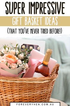 a basket filled with flowers and wine on top of a table next to a bottle of wine