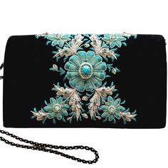 "Stunning black velvet evening clutch bag with detailed and intricately embroidered sparkly silver and turquoise metallic flower and inlaid with genuine turquoise stone. It elevates any outfit to the spectacular. Sparkle away at the rodeo and any western themed event! Expertly hand embroidered by master zardozi artisans to create and opulent and dazzling 3D effect. Sparkles like a perfect little jewel box. DETAILS: - Flap over magnetic closure - Black velvet - measures 8\" H x 5\" W x 2.5 \" D. Elegant Turquoise Bag For Gift, Elegant Turquoise Bag For Formal Occasions, Turquoise Rectangular Shoulder Bag For Evening, Turquoise Rectangular Evening Shoulder Bag, Turquoise Bag, Embellished Purses, Floral Purse, Jewel Box, Genuine Turquoise