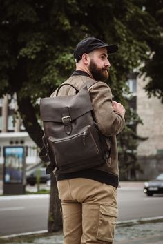 Model Douglas Discover the perfect blend of style and functionality with our City Crazy Horse Leather Backpack. Crafted from high-quality crazy horse leather, this backpack is designed to withstand the rigors of daily urban life while maintaining a timeless, vintage appeal. With multiple pockets, it offers ample storage for all your essentials, making it ideal for work, travel, or casual outings. The adjustable straps ensure comfort, and the durable construction promises longevity. Elevate your Everyday Carry Soft Leather Backpack, Soft Leather Everyday Backpack, Everyday Soft Leather Backpack, Leather Backpack With Waxed Finish For Everyday, Rugged Everyday Backpack With Leather Backing, Rugged Backpack With Leather Backing For Daily Use, Rugged Backpack With Leather Backing For Everyday Carry, Rugged Everyday Backpack, Everyday Rugged Standard Backpack