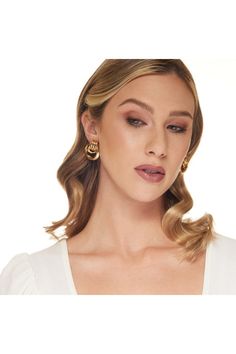 These trendy yet upscale hoop earrings are polished to a bright sheen.  1 1/4 Polished Gold  Love Knot Doorknocker Pierced Earring Feminine Gold Hoop Earrings For Pierced Ears, Gold-tone Hoop Earrings For Anniversary, Knot Design, Love Knot, Kenneth Jay Lane, Brass Earrings, Pierced Earrings, Earrings Set, Earings Piercings