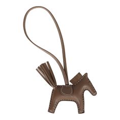 This Hermes Rodeo Bag Charm PM is of Etoupe Milo lambskin leather and matching saddle, loop holder, eyes, tail, and mane.Origin: FranceCondition: New and never wornAccompanied by: Hermes box and ribbonMeasurements: 3.5" width x 3" height; strap drop: 6.5" Winged Horse, Hermes Birkin 25, Hermes Accessories, Hermes Box, Birkin 25, Lambskin Leather, Rodeo, Gold Hardware, Saddle