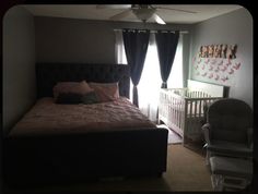 a baby's room with a crib, rocking chair and bed in it