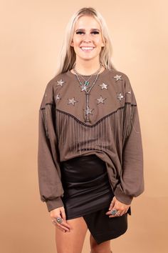 Fringe and sequin star knit sweatshirt -Metal fringe trim -sequin star patches -Round neckline -Long sleeves -High-low side slits Made in USA Sequin Long Sleeve Sweatshirt For Fall, Long Sleeve Outerwear With Tassels For Rodeo, Fall Sequin Long Sleeve Sweatshirt, Sequined Long Sleeve Fall Sweatshirt, Western Long Sleeve Outerwear With Tassels, Long Sleeve Leather Jacket With Fringe For Rodeo, Spring Fringed Long Sleeve Biker Jacket, Star Patches, Rodeo Girls