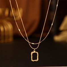 Necklace set with a classic, geometric design to accent an array of ensembles. Pendant : 0.79" L Shorter Chain : 16.54" L with 1.96" extender Longer Chain : 17.72" L with 1.96" extender Lobster claw clasp 18k gold-plated stainless steel Gold Necklace With Adjustable Chain And Rectangular Pendant, Luxury Gold-plated Necklace With Rectangular Pendant, Gold-tone Necklace With Adjustable Chain And Rectangular Shape, Gold-tone Necklace With Adjustable Chain And Rectangular Pendant, 14k Gold-filled Rectangular Pendant Jewelry, Rectangle Pendant Necklace, Rectangle Pendant, Long Chain, Necklace Chain