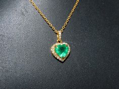 Heart-shaped Emerald Necklaces For Anniversary, Heart-shaped Emerald Necklace For Anniversary, Anniversary Heart-shaped Emerald Necklace, Elegant Heart-shaped Green Emerald Necklace, Elegant Green Heart-shaped Emerald Necklace, Gold Emerald Heart Pendant Jewelry, Emerald Jewelry For Valentine's Day Gift, Emerald Wedding Jewelry For Valentine's Day, Gold Emerald Heart Cut Jewelry