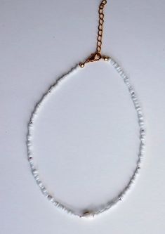 The pearl conch necklace has select sizes available with an adjustable 2-inch extender chain to comfortably fit any size neck. Czech blush and white seed beads surround a mini conch shell to tie it together. Perfect for layering with other necklaces or chokers and great to wear with any outfit. It is made for any look you want; a cute choker or a collarbone necklace. It is carefully crafted to ensure durability so you can wear it everyday! Collarbone Necklace, Layer Necklace, Conch Shell, Necklace Beaded, Seed Bead Necklace, Necklace Dainty, Dainty Necklace, Conch, Necklace For Women