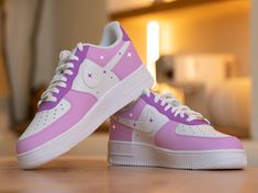 "Step up your sneaker game with the Custom Purple Girly Nike Air Force 1! Designed for bold risk-takers, these sneakers combine ultimate style with comfort. Stand out from the crowd and conquer any challenge with these statement-making kicks!" 🔥 100% genuine, Brand New.👟 Custom sneakers.★Every pair is hand-made and unique.✨Best quality waterproof and scratch-proof paints used.🎉 1000+ satisfied customers across various platforms.🎁 Treat the shoes as art as they are delicate and special.💌 We Custom High-top Sneakers With Air Cushioning, Sporty Custom Sneakers With Fade-resistant White Sole, White Sole Custom Sneakers With Air Cushioning For Streetwear, High-top Custom Sneakers With Air Cushioning And White Sole, Purple Air Force 1 Custom, Lavender Air Force 1, Custom Pink High-top Fade-resistant Sneakers, Lilac Nike Air Force 1, Nike Air Force Purple Sneakers