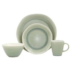 a set of dishes with cups and saucers