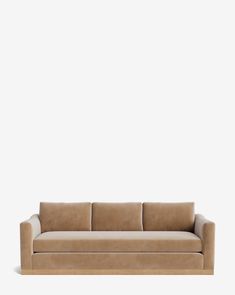 a tan couch against a white wall with no one on it's legs or feet