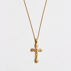 Our detailed cross pendant is placed on our 1mm cable chain for a simplistic touch to the necklace. This necklace is great to be worn as a statement piece in a layered look. We recommend pairing with The Angel Chain in 16" and The Beloved Chain in 18". Stainless Steel 18k Gold Plated Hypoallergenic Pendant size: 3.3" x 1.9" Chain width: 2.2mm Chain length: 18" with 2" extender Gold Crucifix Cross Necklace With Delicate Chain, Cross Pendant Necklace With Cable Chain As Gift, Gold Necklaces With Cross Pendant And Cable Chain, Gold Cross Pendant Necklace On Cable Chain, Gold Cross Pendant Necklace With Cable Chain, Gold Necklace With Cross Pendant And Cable Chain, Yellow Gold Crucifix Necklace With Delicate Chain, Gift Cross Necklace With Cable Chain, Crucifix Cross Necklace With Figaro Chain As Gift