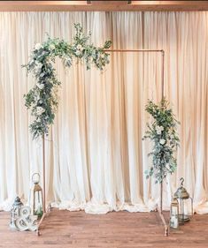 a wedding ceremony setup with white flowers and greenery