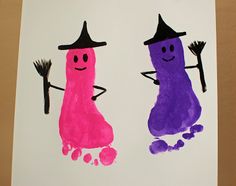 two purple and pink handprints with one holding a broom, the other wearing a witches hat