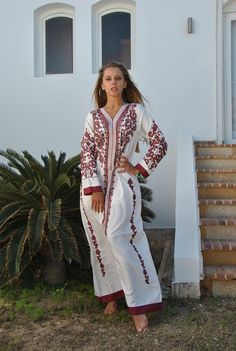 "A stunning embroidered Kaftan dress that is elegant, colorful, and unique! The dress is made of Egyptian cotton that has a soft feel to it so you will surely feel comfortable and royal in it. It also comes with a small invisible pocket on the right side of the Kaftan for added practicality. You can wear this Kaftan practically anywhere and for any occasion. You can dress it up with a pair of heels and strut like an Egyptian queen in any gathering, resort, or party. Or you can dress it down with Elegant Long Sleeve Kaftan With Multicolor Embroidery, White Long Sleeve Abaya With Floral Embroidery, White Long Sleeve Tunic For Eid, White Long Sleeve Eid Tunic, White Eid Dresses With Embroidered Border, Embroidered White Tunic For Eid, White Tunic Kaftan With Chikankari Embroidery, White Chikankari Embroidery Kaftan Tunic, White Embroidered Tunic Kaftan