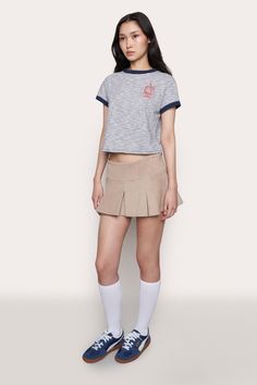 Model is 5'9.5" and wearing a size S Model measurements: 30" bust, 33” hips, 22" waist Composition: 100% Cotton Champion Logo, Corduroy Skirt, Logo Tee, Logo Tees, S Models, Model Measurements, Product Launch, Composition, Socks