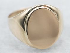 "This unisex signet ring has a modest profile on the hand and is completely un-decorated. These features make it versatile, an easy gift to give, and an easy ring to wear day-to-day.  Market Square Jewelers works with one of the finest hand engravers in the northeast. With over 30 years of experience, our engraver hand carves lettering, monograms, crests, or patterns in period-specific styles. Choose from our many monogram options shown in the listing or contact us directly with your own crest, monogram, or for additional information, and pricing! Metal: 10K Yellow Gold Width of Band: 15.7 mm Height off Finger: 2.3 mm Ring Size: 9.75 Marks: \"10K\" Stamped on the inside band To view a video of this piece check out the link below: https://vimeo.com/810551888 SKU #: A22006 Each piece has bee Market Square, Gold Statement Ring, Gold Signet Ring, Gold Gift, Gold Pattern, Jewelry Companies, Easy Gifts, Unique Engagement Rings, Signet Ring