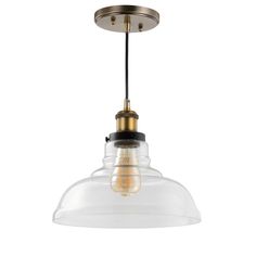 an industrial style light fixture with clear glass and gold accents on the bottom, hanging from a