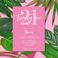 a pink 21st birthday party card with the number one on it, surrounded by tropical leaves