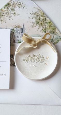 the wedding stationery is laid out on top of an envelope