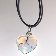 Opalite Wire Wrapped Crystal Necklace made in black adjustable cord. Adjustable Heart-shaped Wire Wrapped Necklace, Opalite Jewelry, Wire Wrapped Crystal Necklace, Wrapped Crystal Necklace, Opalite Necklace, Opalite Crystal, Wire Wrapped Crystal, Heart Shaped Pendant, Wrapped Crystal