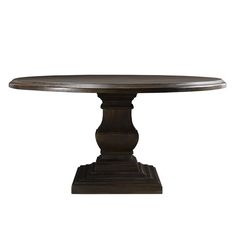 a round wooden table sitting on top of a white floor next to a metal base