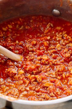 a large pot filled with lots of sauce