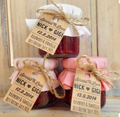 three jars filled with jam sitting next to each other