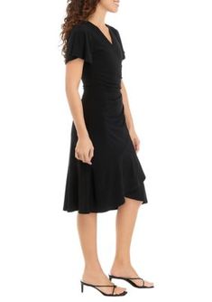 This pretty faux wrap dress from AK Anne Klein is elevated with flutter sleeves & a ruffle skirt. | AK Anne Klein Women's Petite Faux Wrap Dress, Black, PS Calvin Klein Fitted Short Sleeve Dress, Black V-neck Surplice Dress For Spring, Navy Calvin Klein Dress, Calvin Klein Black Short Sleeve Dress, Calvin Klein Knee-length Ruffled Dress, Wrap Dress Black, Faux Wrap Dress, Ruffle Skirt, Flutter Sleeves