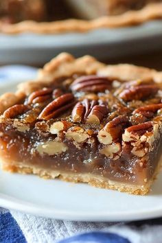 a slice of pecan pie on a white plate