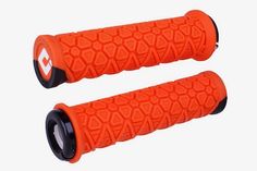 two orange grips that are on top of each other