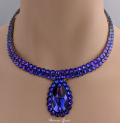 This necklace comfortable against the skin, it is not stiff or scratchy. It closes in the back with velcro.Heliotrope is a beautiful purple color with reflections of many shades. This is a simple design that will not compete with dress designs, but will fill in your neckline. The stones are not secured with any metal fittings so this will not snag your costume or your partners. The clear design will match any dress that you own because it has flesh tone background the only thing visible are the Purple Pendant Jewelry For Party, Purple Jeweled Necklace For Party, Purple Crystal Necklaces For Party, Purple Teardrop Necklace For Jewelry Making, Purple Teardrop Necklaces For Jewelry Making, Purple Teardrop Pendant Necklace For Jewelry Making, Purple Teardrop Pendant Necklace For Formal Occasions, Purple Teardrop Necklace For Formal Occasions, Purple Teardrop Necklace For Formal Events