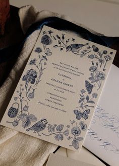 the wedding stationery is laid out on top of each other