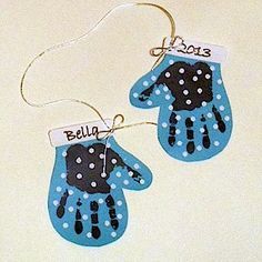 two handprinted blue mittens hanging from a string